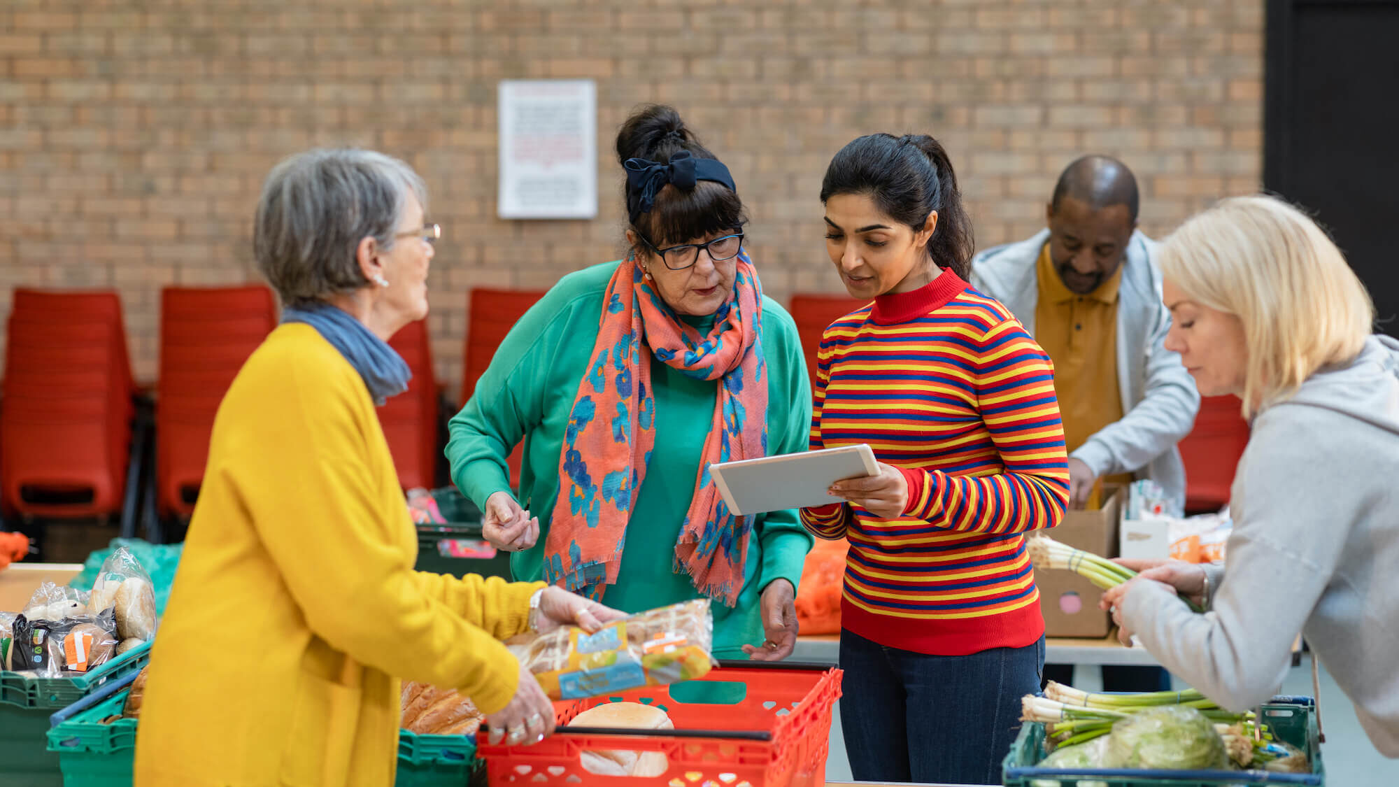 A group of women working at a food bank